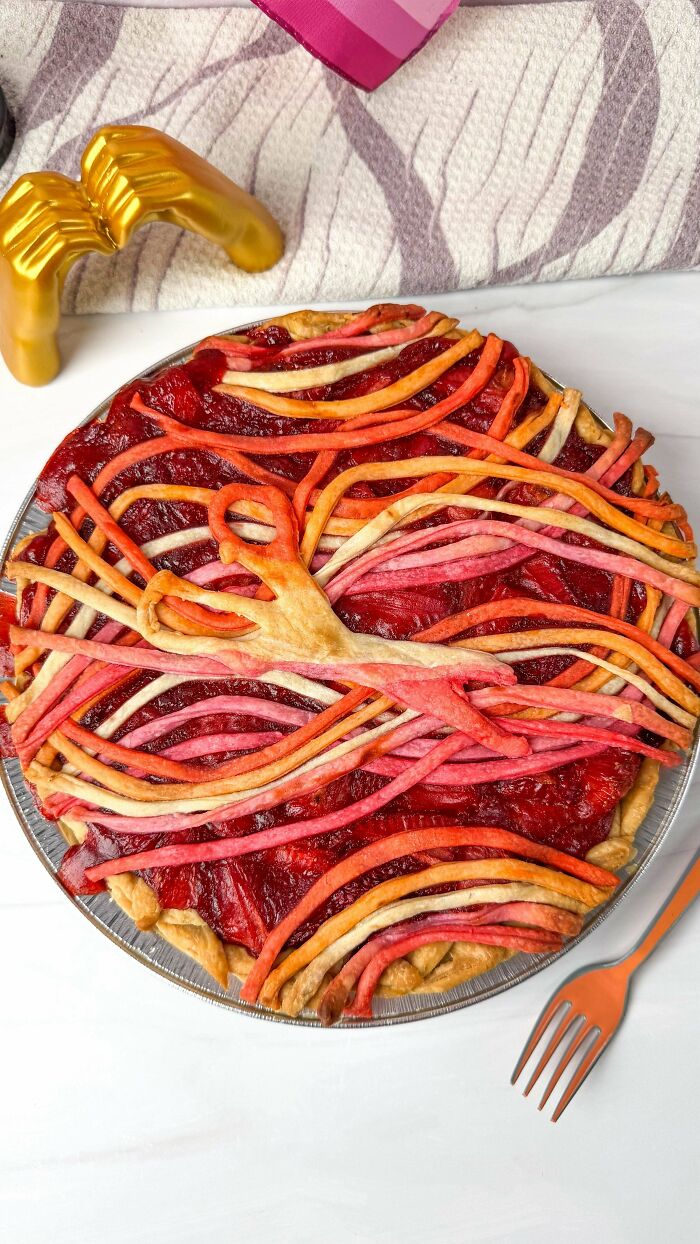 Colorful strawberry pie with artistic crust design