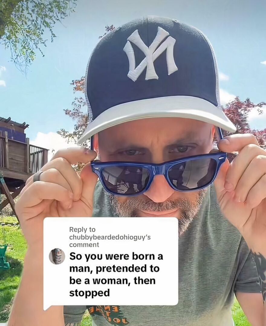 A man in a Yankees cap and blue sunglasses looks at a comment on LGBTQ+ allyship, highlighting accidental support.