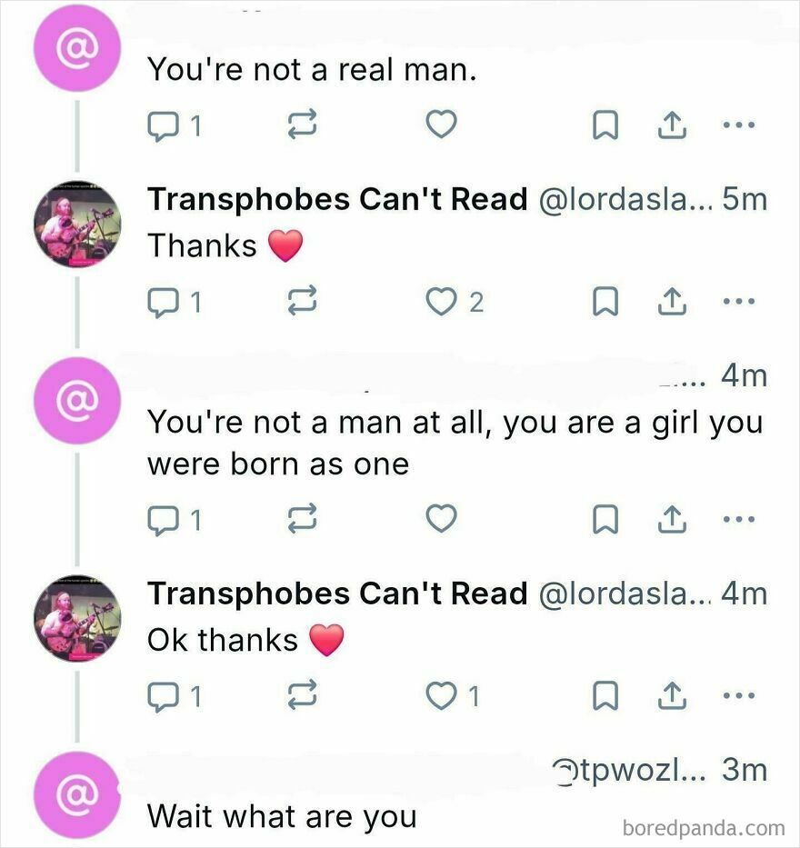 Screenshot of a Twitter conversation showing accidental LGBTQ+ allyship, with a user responding to transphobic comments.