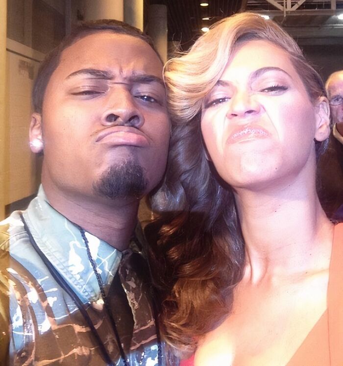 Man and Beyoncé making funny faces in a selfie, a wild photo of celebrity encounters.