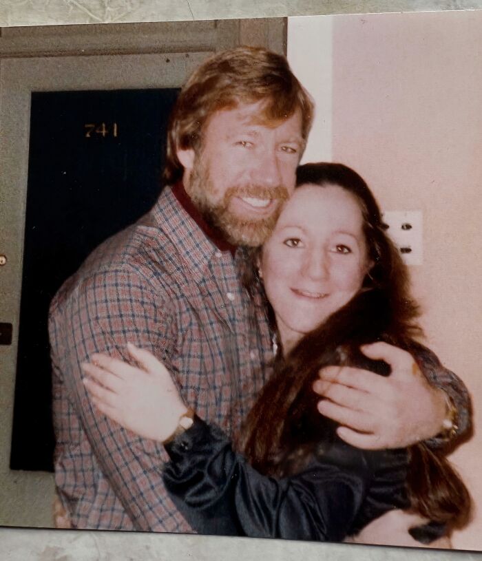 Chuck Norris embracing a woman, both smiling for a photo, a celebrity encounter that went beyond expectations.