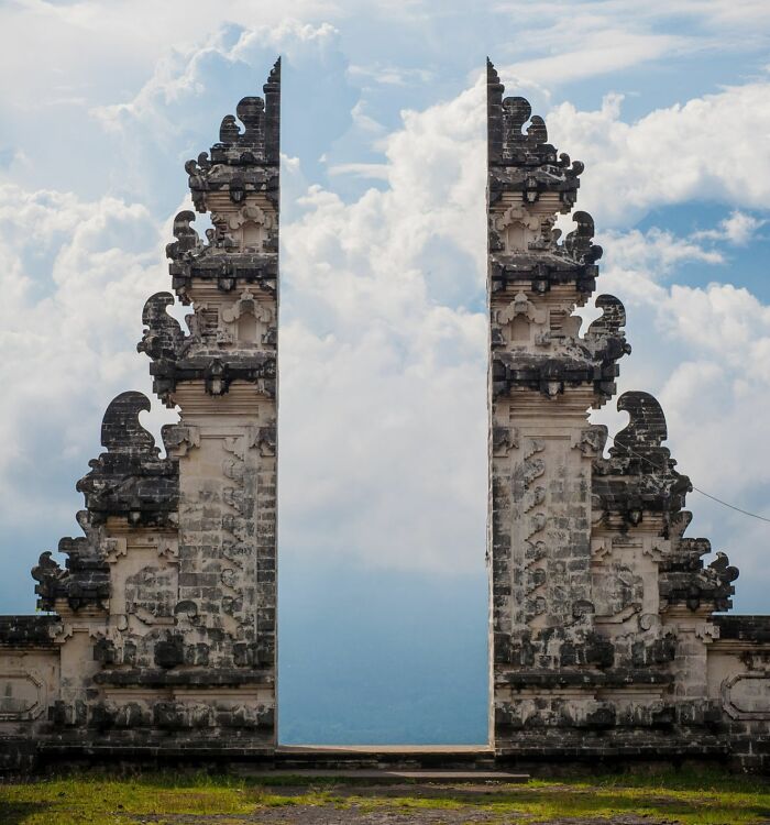 A split gate of an ancient temple framing the sky, a satisfying picture for a gentle reset.