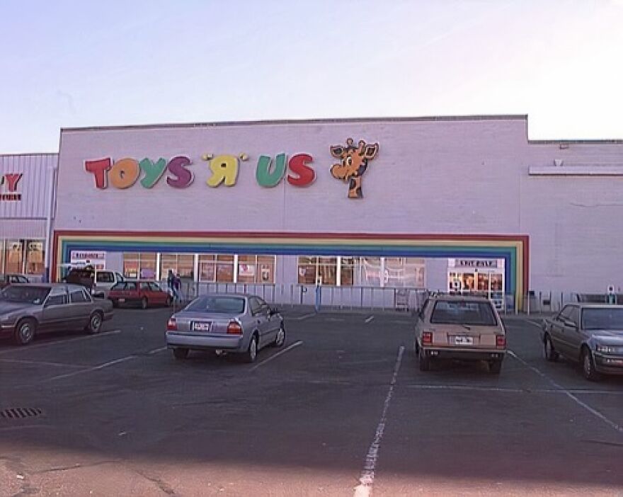 A vintage Toys R Us store with Geoffrey the Giraffe on the facade, evoking a trip down memory lane for many.