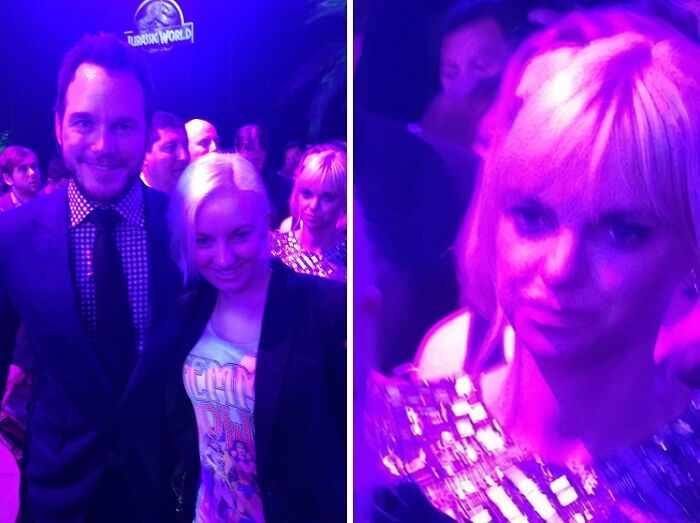 Chris Pratt smiling beside a blonde woman at a Jurassic World event. Another woman in a sequined dress behind them. Celebrity encounters.
