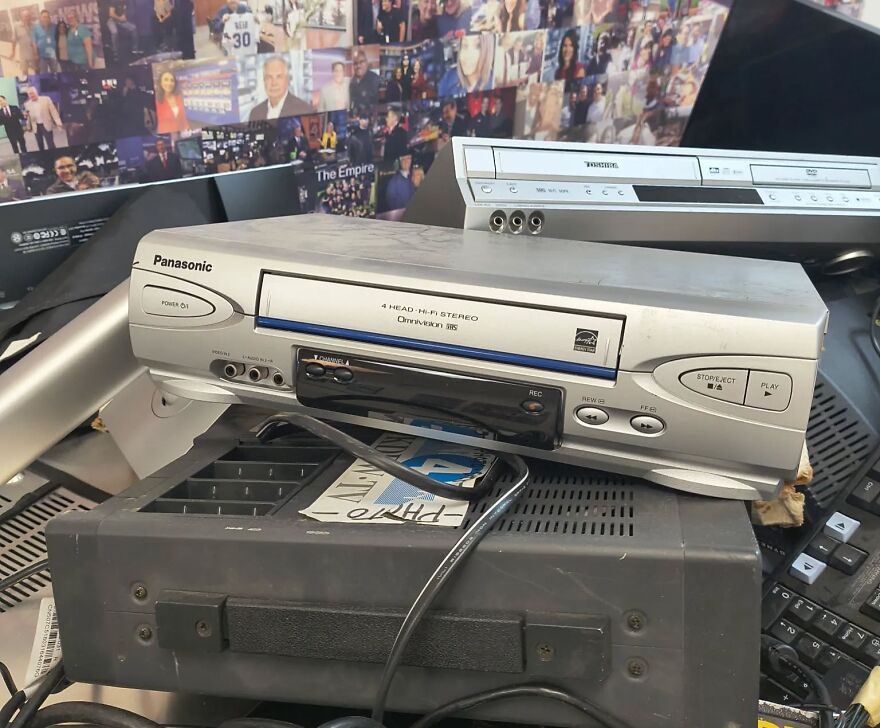 A close-up of a silver Panasonic VCR and a DVD player, evoking a trip down memory lane with vintage electronics.