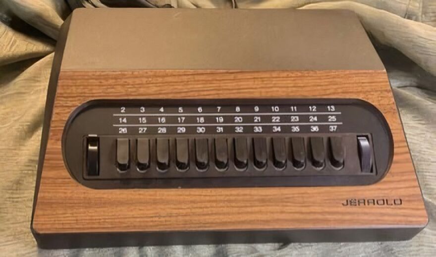 An old Jerrold cable box with a wooden grain finish and numbered channel buttons, a trip down memory lane.