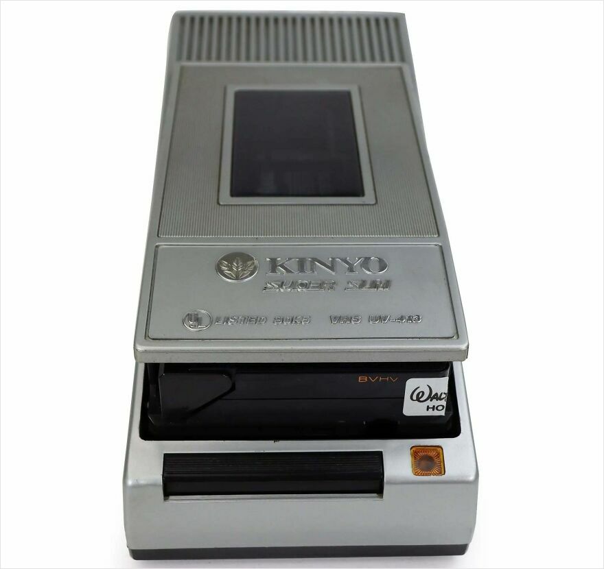 A vintage Kinyo Super Slim VHS rewinder with a VHS tape inserted, evoking a trip down memory lane.