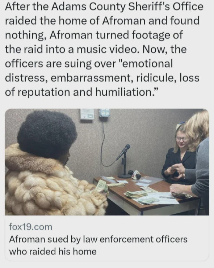 Afroman in a fur coat sitting at a table with money, illustrating a chaotic good response to a police raid.