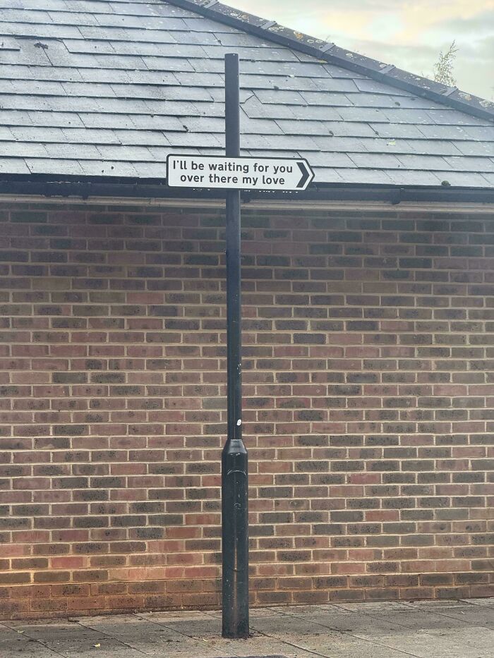 Signpost with romantic message waiting for you over there my love