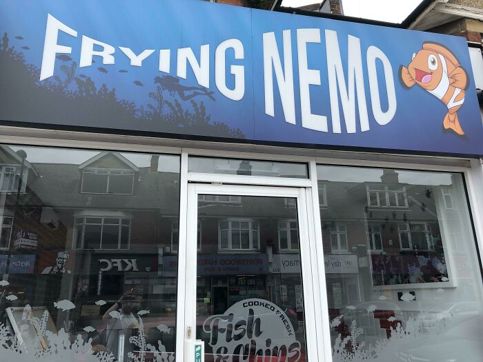 Fish and chips shop sign named Frying Nemo with cartoon fish