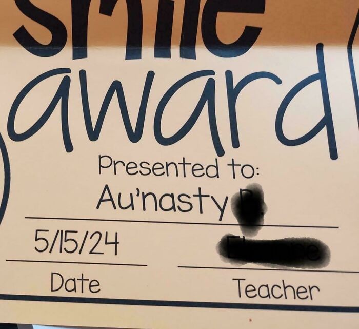 A "Smile Award" certificate presented to "Au'nasty" dated 5/15/24, a questionable kid naming choice.