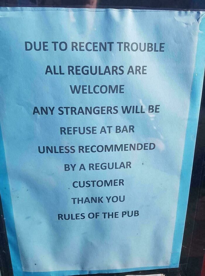 British pub rules sign limiting strangers without regular's recommendation