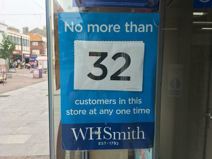 Humorous WHSmith sign limiting customers to 32 at one time