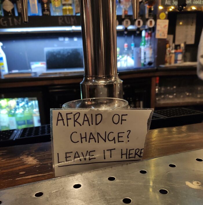 Bar sign saying afraid of change leave it here in a humorous way