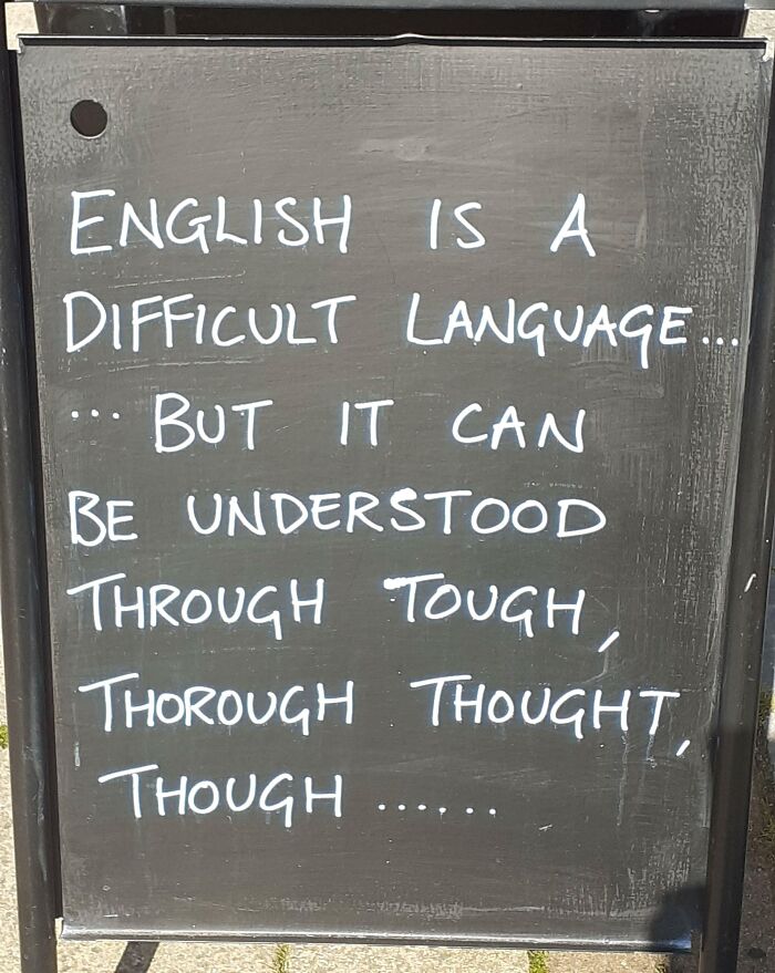 Chalkboard joke about English language being tough but understandable