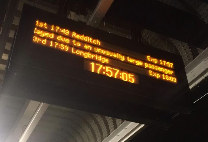 Amusing train departure board warning about unusually large passenger