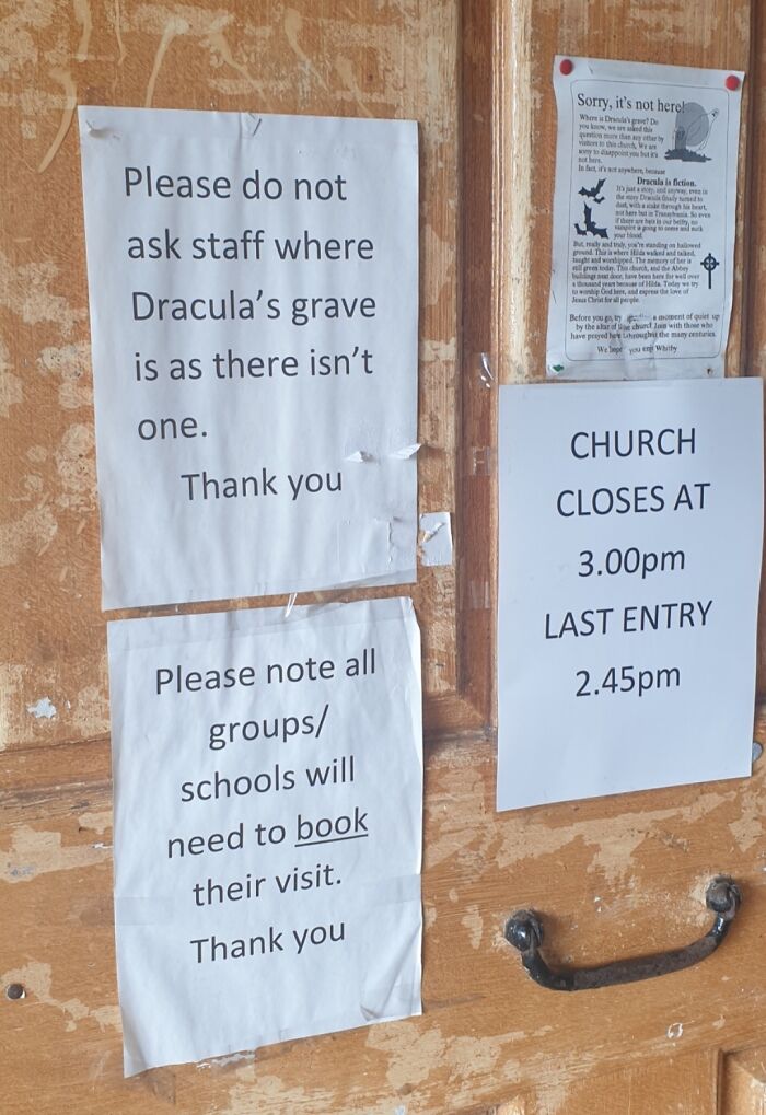 Notices stating Dracula's grave does not exist and church visiting rules