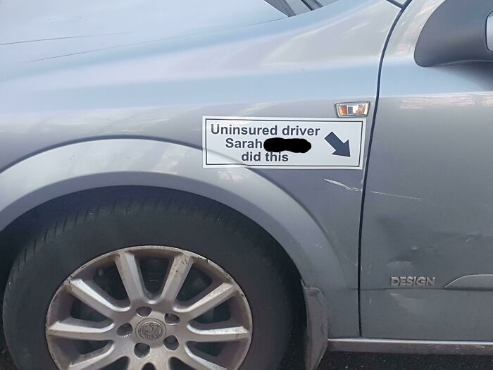 Sign on car accusing uninsured driver Sarah of causing damage