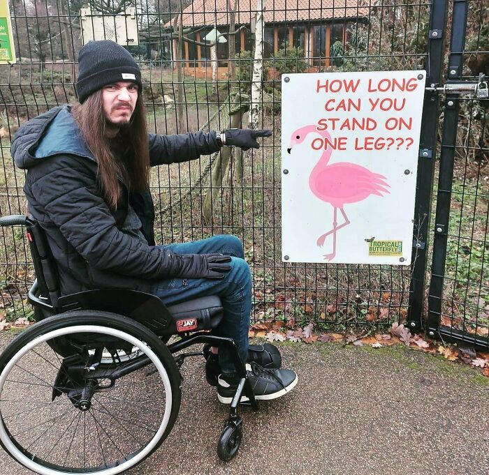 Funny sign challenging how long you can stand on one leg with flamingo