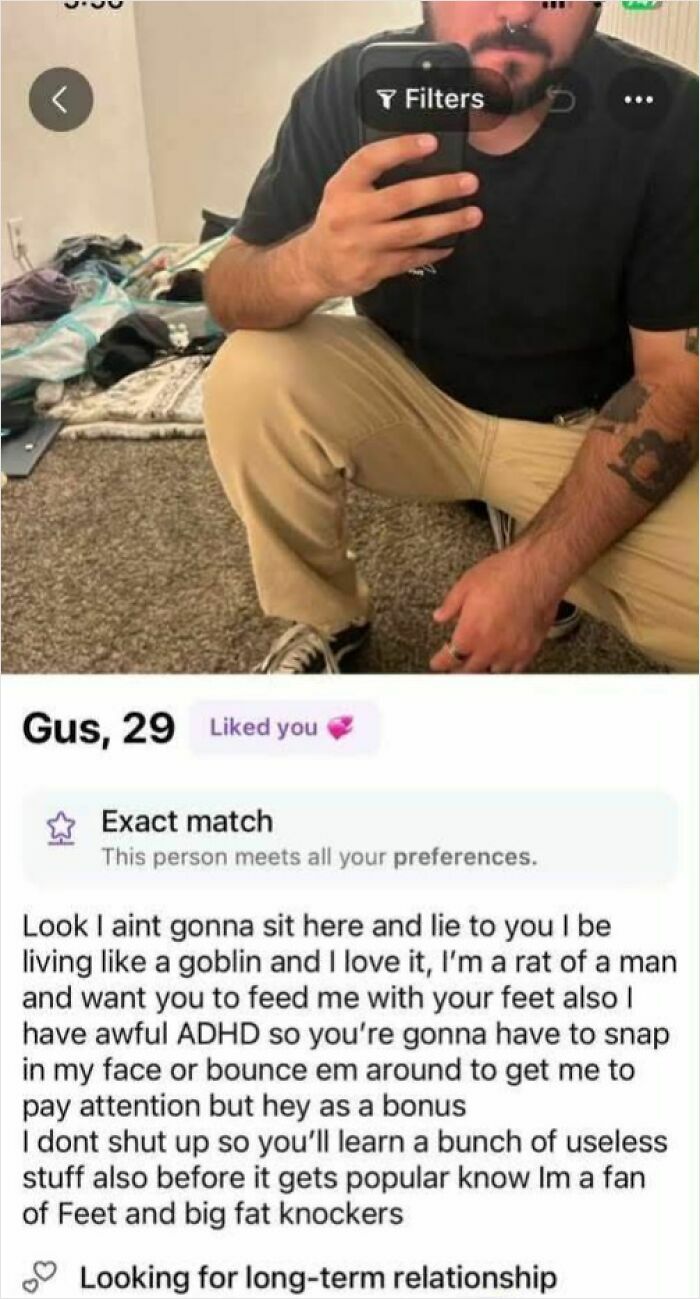 A man with a nose ring and beard taking a selfie, showing a messy room behind him. Might make your inner goblin laugh.