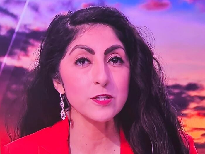 Woman in red top with black hair and bold eyebrows, illustrating potential beauty disasters.