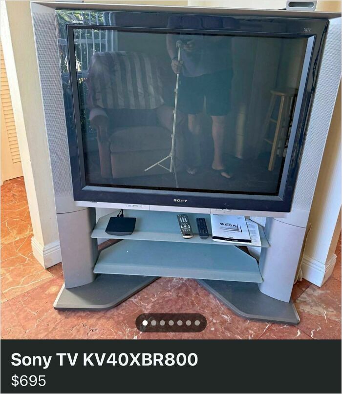 An old Sony Trinitron TV with a stand, remotes, and manual. This item might be considered trash to some, but quick money for others.