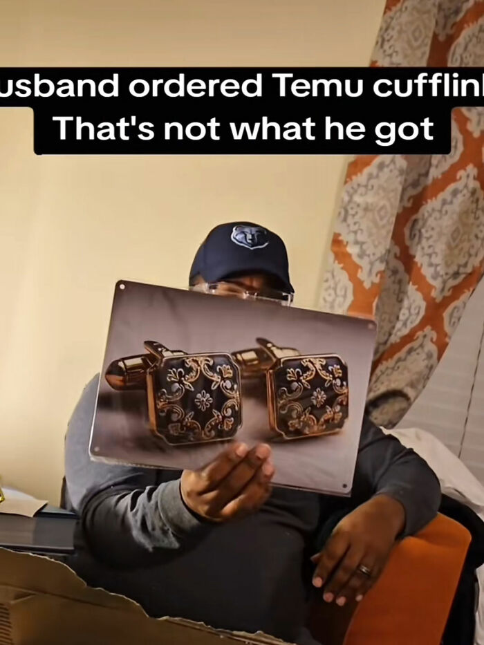 Man holding a large print of Temu cufflinks he ordered, illustrating a funny Temu purchase fail story.