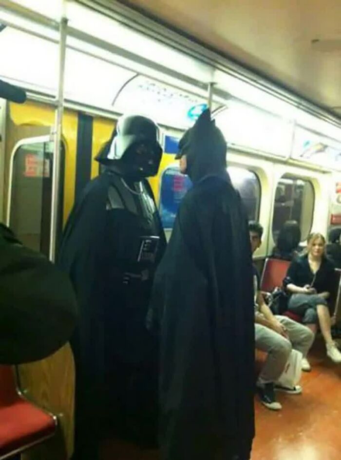 Darth Vader and Batman face off on a subway, a truly weird image that will live rent-free in your mind.