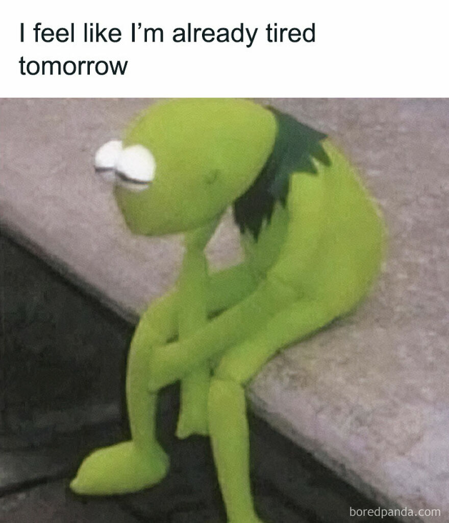 Kermit the Frog looking tired, sitting with head in hand, perfectly depicting funny and relatable memes.