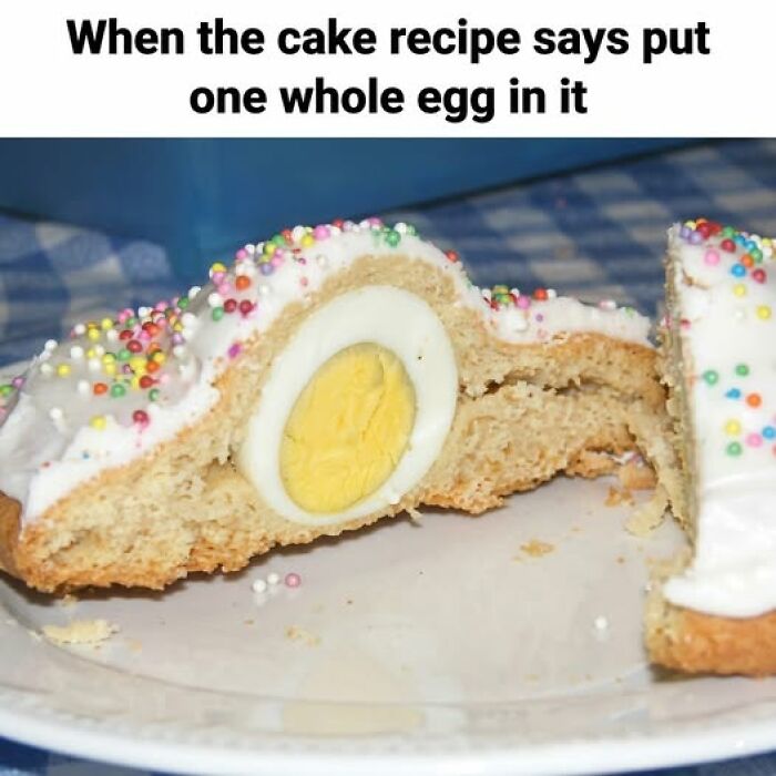 Cake slice with icing and sprinkles reveals a whole boiled egg inside, showcasing a funny food meme about baking instructions.