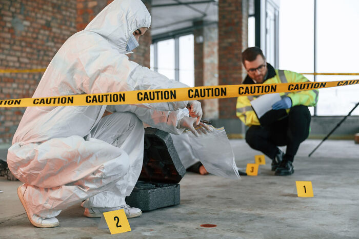 Forensic experts at a crime scene. This image hints at nasty, revolting things medical workers wish they could unsee.