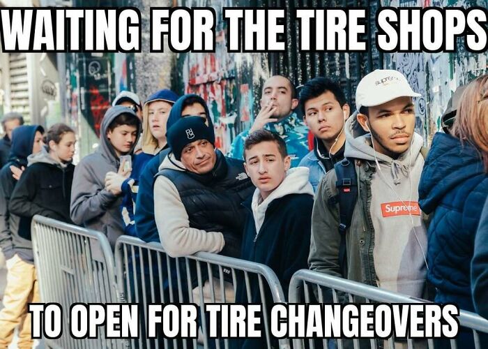People lined up outdoors, with the text "WAITING FOR THE TIRE SHOPS TO OPEN FOR TIRE CHANGEOVERS", a meme about living in Alaska.
