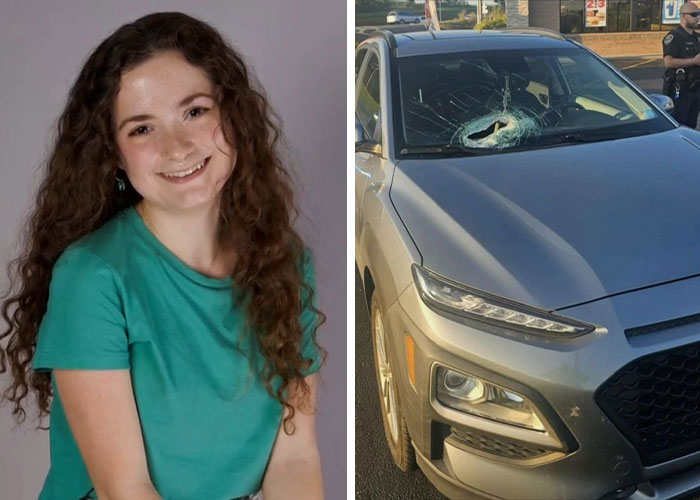 A young woman with curly hair smiles next to a car with a shattered windshield, a freak accident.