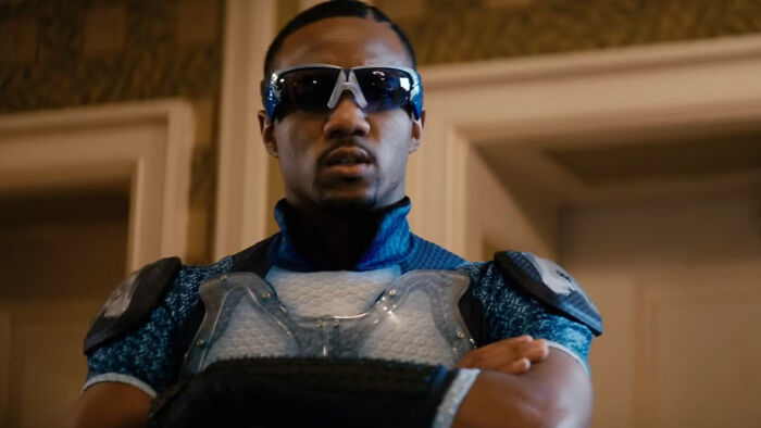 A-Train from The Boys Season 5 wearing a blue suit and sunglasses, confirming his fate in a dramatic scene.