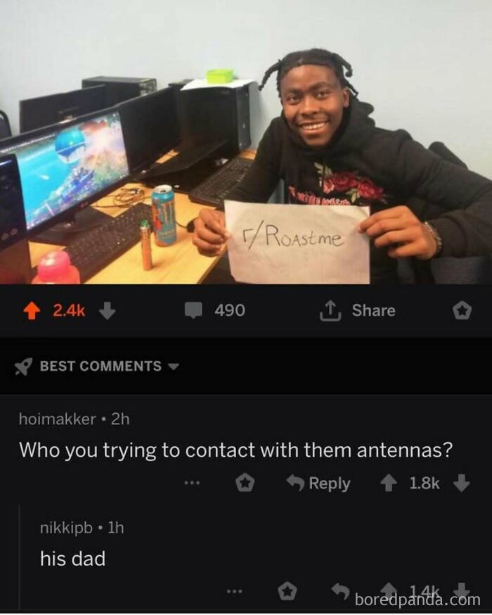A smiling person holding a r/Roastme sign with a viral comment: "Who you trying to contact with them antennas? his dad." A rare burn.