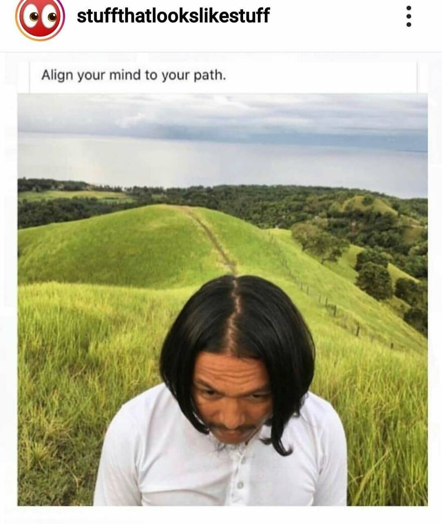 Man with black hair aligning his head with a grassy hiking trail on rolling hills in nature camping meme.