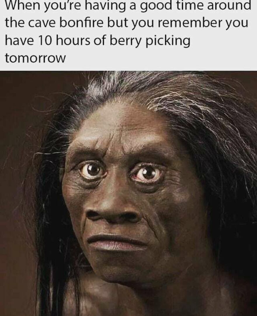 Expression of a person looking worried about camping and hiking tasks after enjoying a cave bonfire moment.