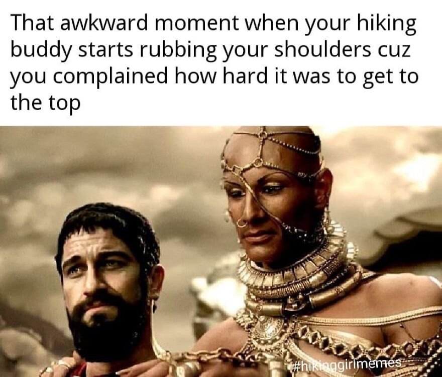 Man with beard looking awkward while a tattooed and adorned woman rubs his shoulders hiking meme about reaching the top