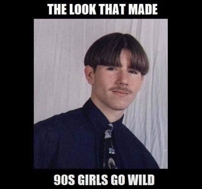 Teen boy with 90s bowl haircut and mustache wearing a dark shirt and patterned tie, a classic 90s meme nostalgia look.