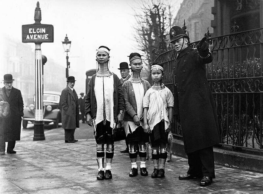 Fascinating photo showing Padaung women with neck rings and a British policeman on Elgin Avenue, offering history lessons.
