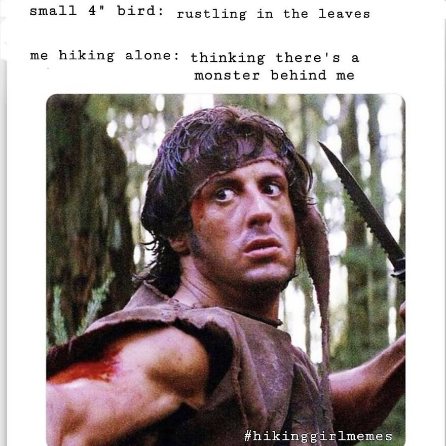 Hiker looking scared with knife in forest capturing camping and hiking meme about nature worries.
