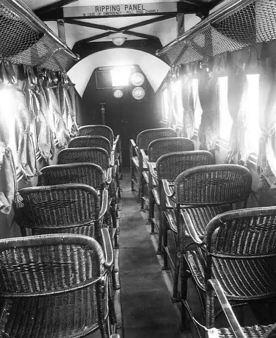 Vintage photo of an airplane cabin with wicker seats, a fascinating photo showcasing history and early aviation.