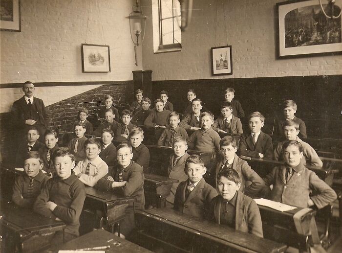 Vintage classroom photo showing boys and a teacher, a rare and interesting moment from a time we will never experience again.