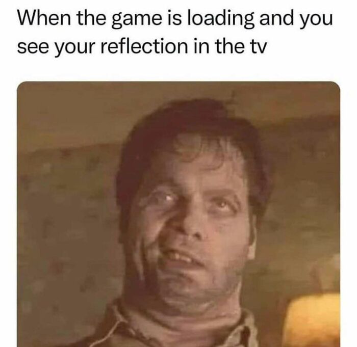 90s meme showing a man making a funny face with caption about seeing your reflection while a game is loading on TV.