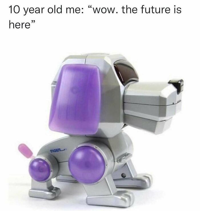 Retro 90s robotic dog toy with purple accents, evoking nostalgia from the decade’s memorable memes and childhood tech.