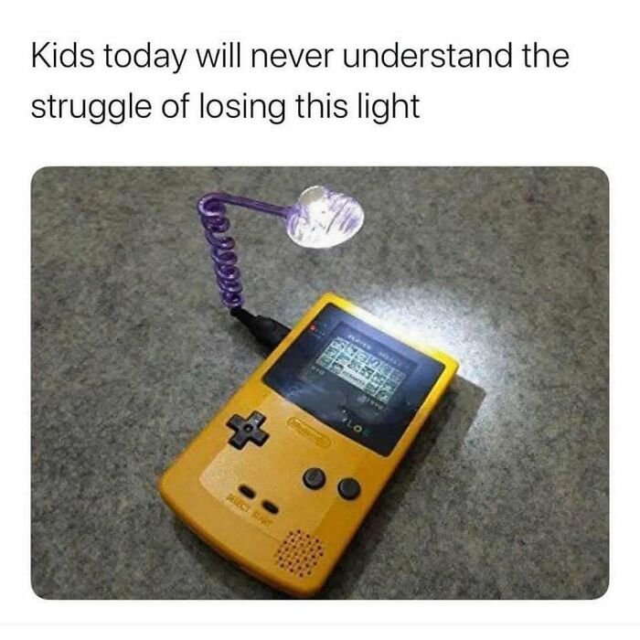 Yellow Game Boy with a small flexible light attached, illustrating ’90s memes and nostalgia for retro handheld gaming.
