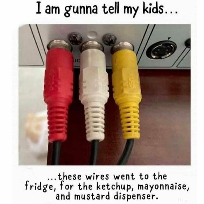 Red, white, and yellow AV cables plugged in, humorously described as ketchup, mayonnaise, and mustard in ’90s memes nostalgia.
