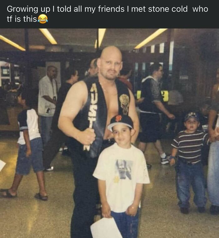 Man in sleeveless vest posing with a child at an event, capturing a moment from 90s memes nostalgia.