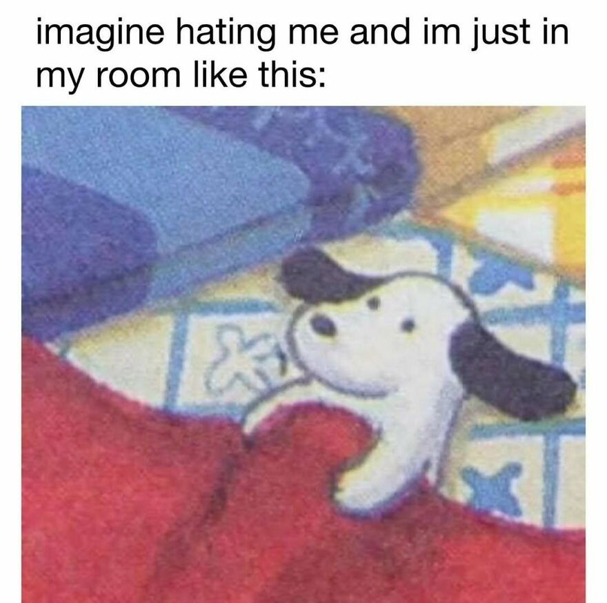 A funny meme showing a cartoon dog in bed under red covers, with text about people hating him. Relatable memes.