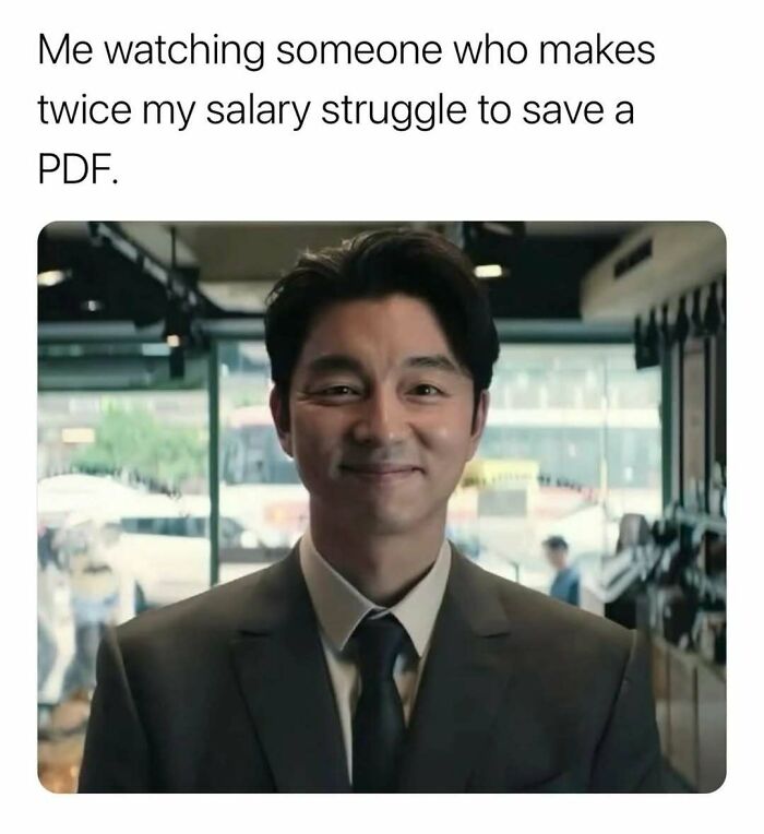 Man in suit smiling knowingly in a meme about relatable adulthood struggles with saving a PDF file.